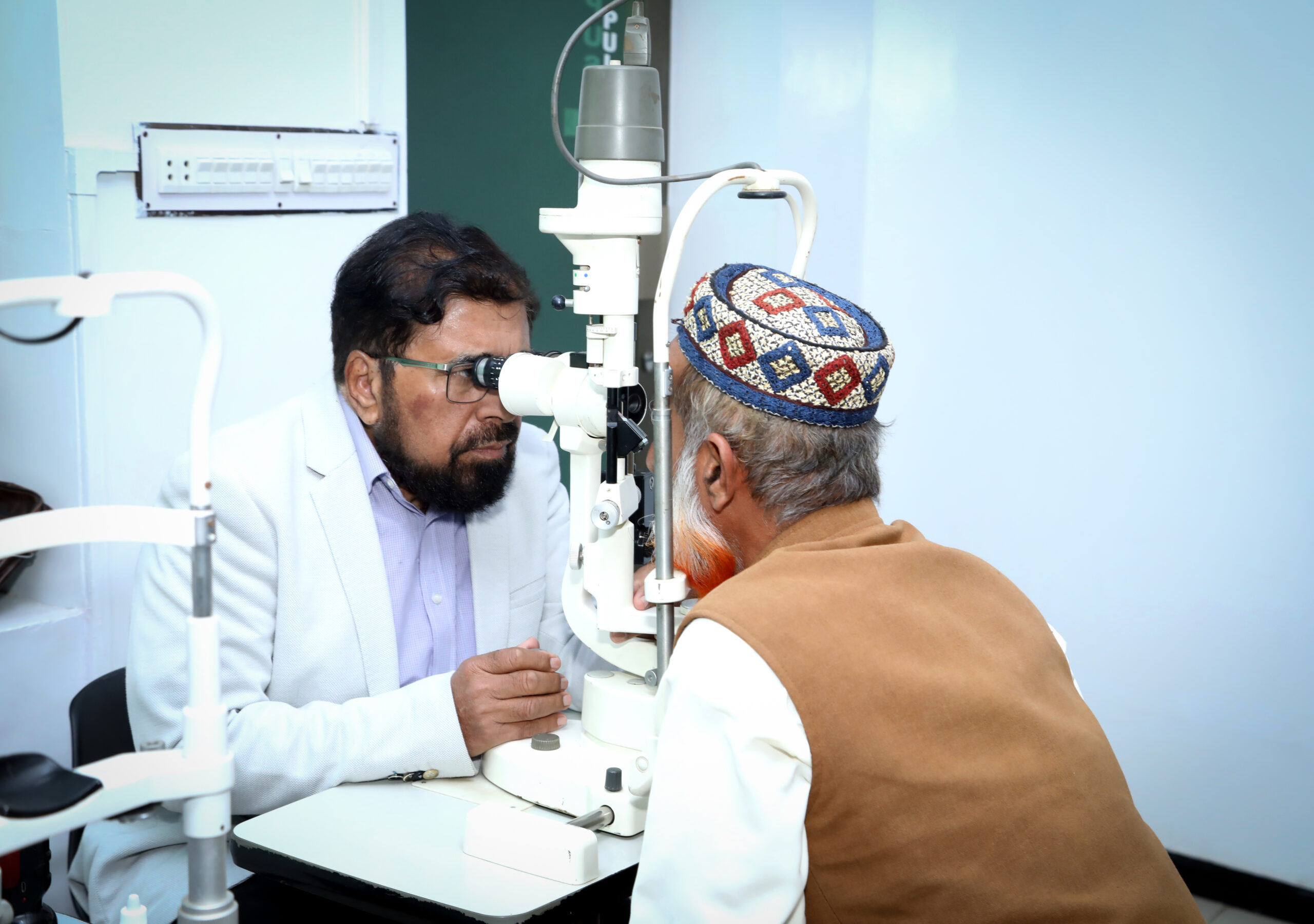 Eye care doctor examining the patient